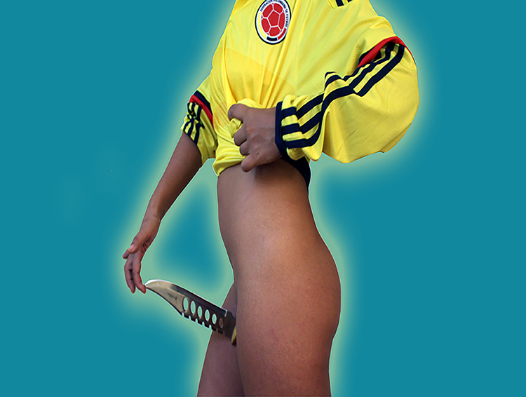 A figure's body is shown from the shoulders to their thighs, appearing in profile, facing the left. They wear a yellow shirt pulled up to their chest and are otherwise nude. Their right hand touches the tip of a knife blade jutting out between their legs.